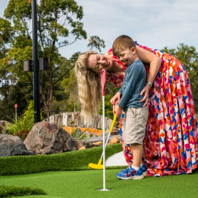 mum and son mini golfing